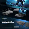 GPD WIN Mini 2024, angeschlossen an eine externe GPU (eGPU) und einen großen Monitor. Das kompakte Gerät zeigt auf seinem 7-Zoll-Bildschirm eine futuristische gepanzerte Figur. Die eGPU-Einheit verbessert die Grafikleistung. Der große Monitor zeigt eine erweiterte Spielansicht. Das Setup demonstriert die Vielseitigkeit - von tragbaren Spielen bis hin zu Desktop-Leistung. Der Text hebt hervor: "Steigern Sie Ihre Spiel- und Arbeitsleistung mit einer eGPU". Verfügt über USB-4-Anschlüsse mit 40 Gbps-Geschwindigkeiten, kompatibel mit Zubehör und Dockingstationen. Hinweis: GPD G1 eGPU ist separat erhältlich.