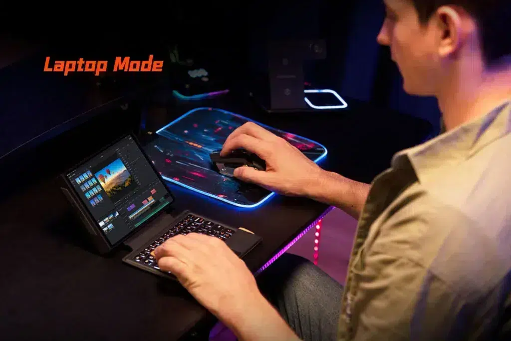 gempages_522757109238989843-0221d68c-3ed8-48b8-bb02-e72d0ed70a91 - DROIX EU The ONEXPLAYER X1 Mini used as a compact laptop setup with a keyboard and mouse, running video editing software, highlighting its versatility for creative and productivity tasks.