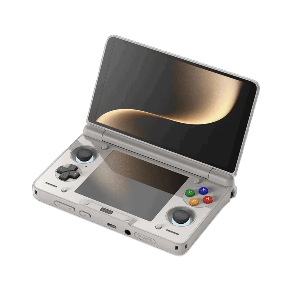 Gaiši pelēkas AYN Thor rokas spēļu konsoles ar gliemežnīcas konstrukciju skats leņķī uz tumša, bezpriekšmetu fona. Augšējais ekrāns ir atvērts, uz tā redzams maigs zelta krāsas abstrakts attēls. Ierīces apakšējā daļā redzamas vadības ierīces, tostarp melns D-pad, melnas analogās stūres un sarkanas, zilas, zaļas un dzeltenas sejas pogas, kas atgādina klasisko "varavīksnes" kontrolieru estētiku. Gan augšējais, gan apakšējais ekrāns ir atstarojošs, atspoguļojot zeltaino gaismu.   