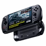 A dynamic shot of two black GPD WIN 5 handheld gaming consoles on a black background. The top device is angled to show its screen, which displays a first-person shooter game and features prominent overlays: 7" screen, AMD Ryzen AI Max, AMD Radeon 8060S graphics, 128GB RAM, and 4TB NVMe SSD. The bottom device is flipped over, showing its ergonomic grips and ventilation grilles.