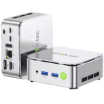 Three-quarter product shot of two silver GMKtec G10 Mini PCs on a black background, showcasing the reflective metallic chassis, the front ports with the green power button, and the rear I/O connectivity options.